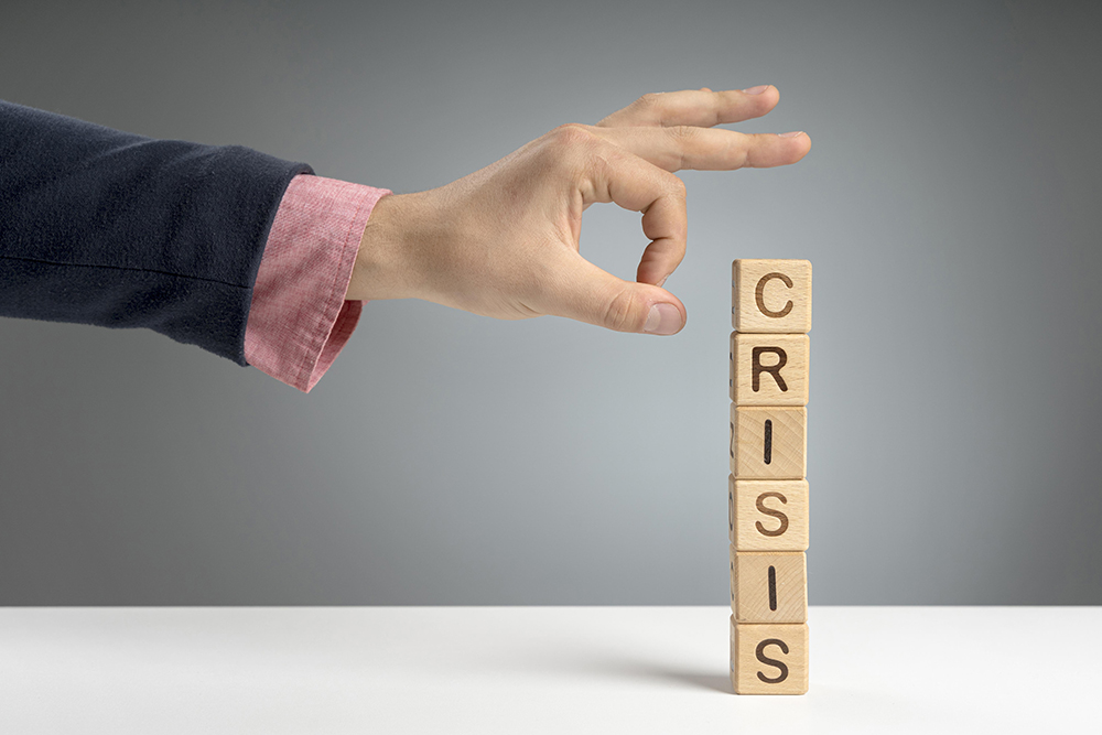 wooden-blocks-with-crisis-mesage-desk